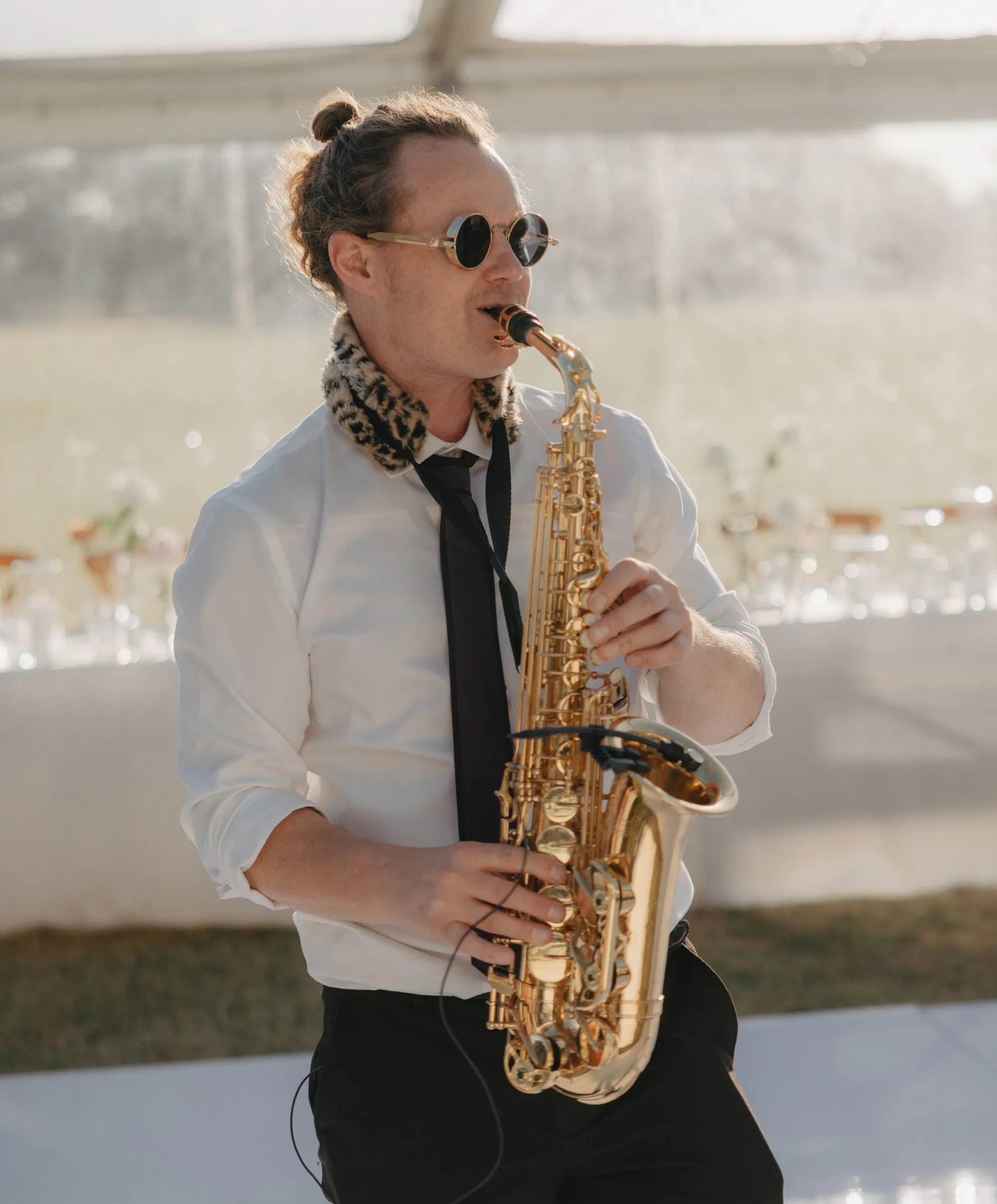 Ian performing live saxophone at a wedding